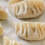 Local Cuisine - Traditional oriental dumplings in bamboo steamer