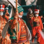 Cultural Traditions - People Wearing Costumes in a Street Parade