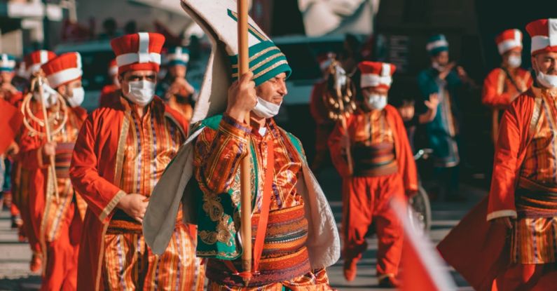 Cultural Traditions - People Wearing Costumes in a Street Parade