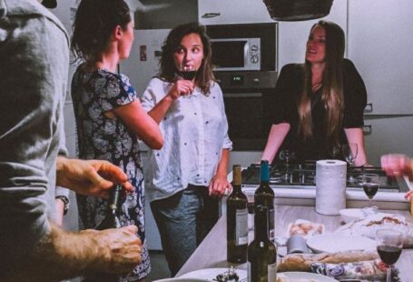 Festival Cuisine - Men and Women Standing Infront of Dining Table