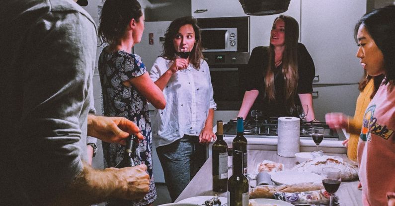 Festival Cuisine - Men and Women Standing Infront of Dining Table