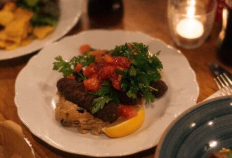 Iconic Dishes - A table with plates of food and drinks