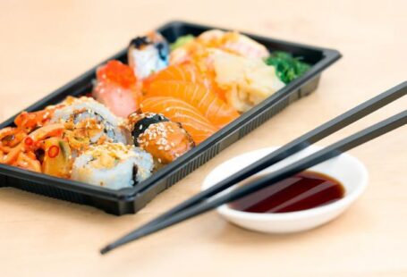 Asian Cooking Methods - Close-up Photo of Sushi Served on Table