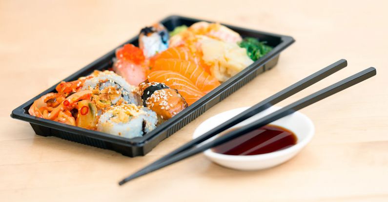 Asian Cooking Methods - Close-up Photo of Sushi Served on Table