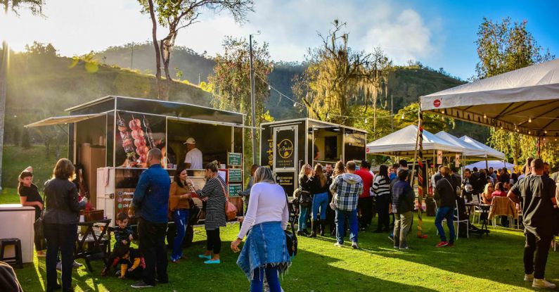 Food Carts - Group of People Standing on Green Grass Field